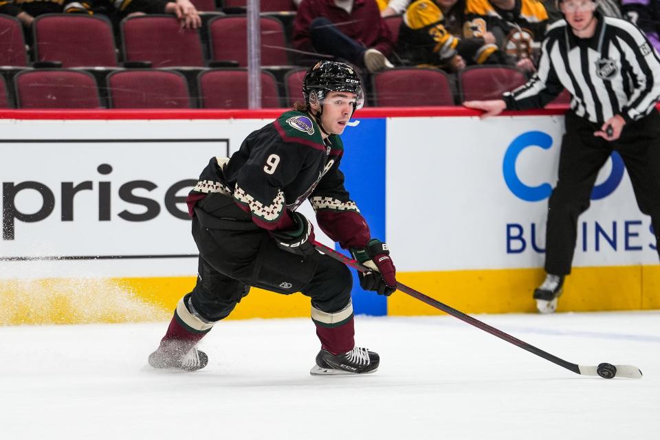 Arizona Coyotes right wing Clayton Keller (9) scans the rink during the first period against the Boston Bruins at Gila River Arena on Friday, Jan. 28, 2022, in Glendale. The game finishes in a 2-1 loss to the Coyotes.