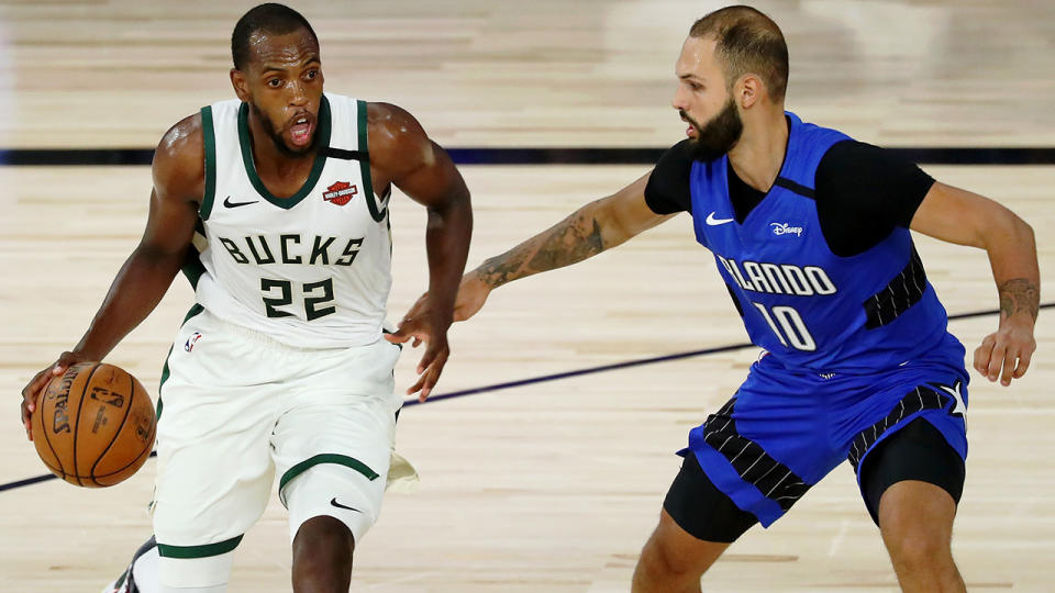 Milwaukee's Khris Middleton is pictured dribbling against Orlando Magic opponent Evan Fournier.