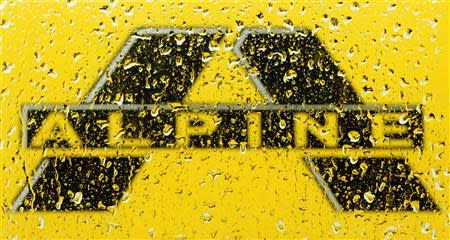 A logo of Alpine Bau is pictured through raindrops on a window in Vienna in this June 24, 2013 file photo. REUTERS/Heinz-Peter Bader/Files