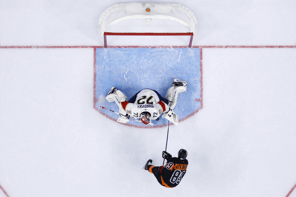 Philadelphia Flyers' Cam Atkinson (89) scores a goal against Florida Panthers' Sergei Bobrovsky (72) during the second period of an NHL hockey game, Saturday, Oct. 23, 2021, in Philadelphia. (AP Photo/Matt Slocum)