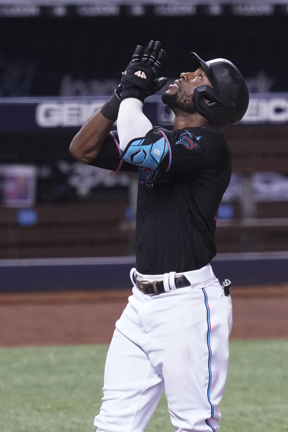 Miami Marlins' Starling Marte (6) looks up after scoring a three-run home run during the eighth inning of a baseball game against the San Francisco Giants, Friday, April 16, 2021, in Miami. (AP Photo/Marta Lavandier)