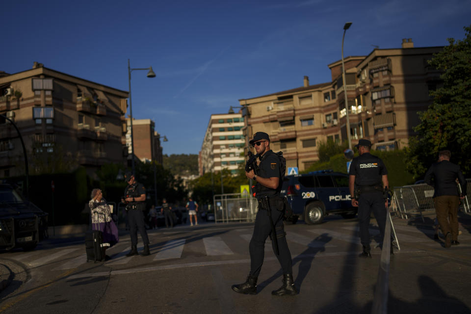 Police officers stand guard next to the Congress center in Granada, southern Spain, Wednesday, Oct. 4, 2023. Almost all of Europe's leaders will gather Thursday in and around one of the most renowned havens of tranquility Spain's Alhambra Palace seeking to fix their increasingly turbulent and violent continent which is seeing war and political instability starting to unhinge nations and institutions. (AP Photo/Manu Fernandez)