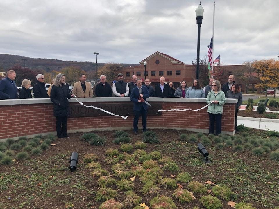 Hornell Mayor John Buckley cuts the ribbon to officially open Union Square Park Thursday, Nov. 2, 2023. The new park at the corner of Seneca and Genesee was supported by Downtown Revitalization Initiative funding.