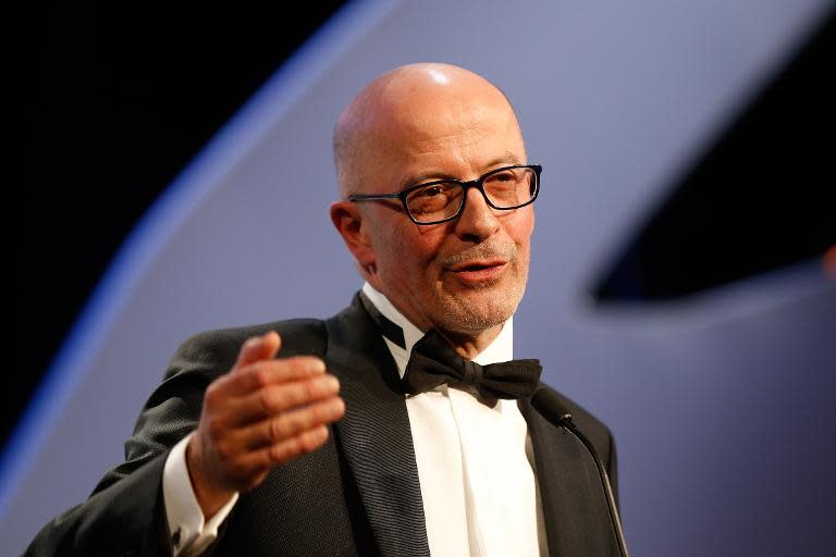 French director Jacques Audiard on stage to accept the Palme d'Or at the 68th Cannes Film Festival