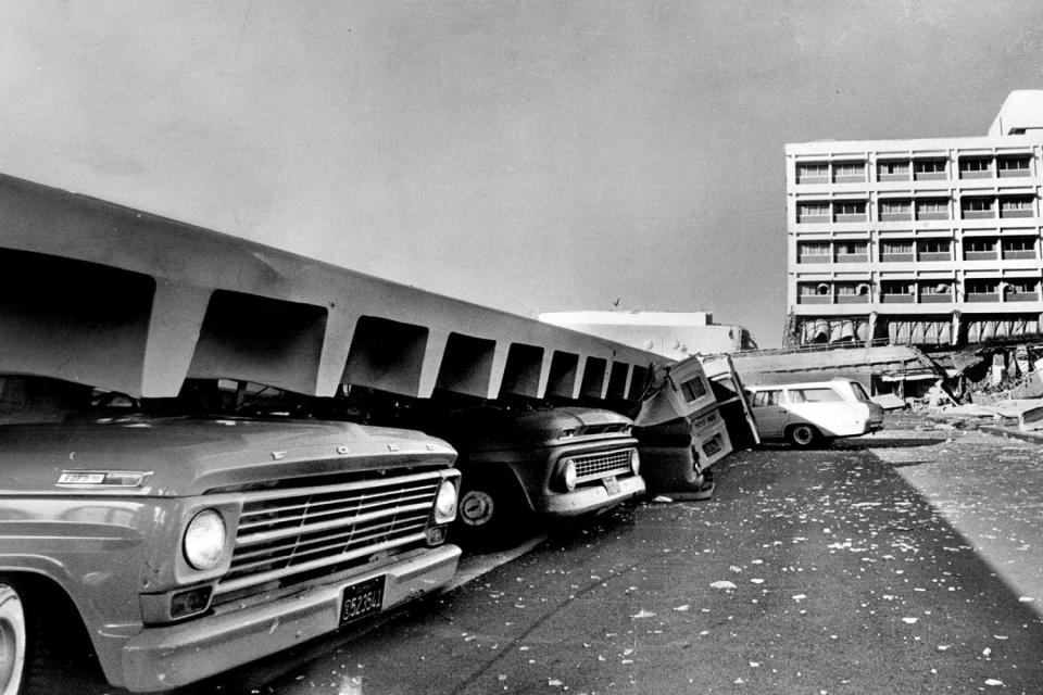 Automobiles crushed by falling debris brought on by an earthquake