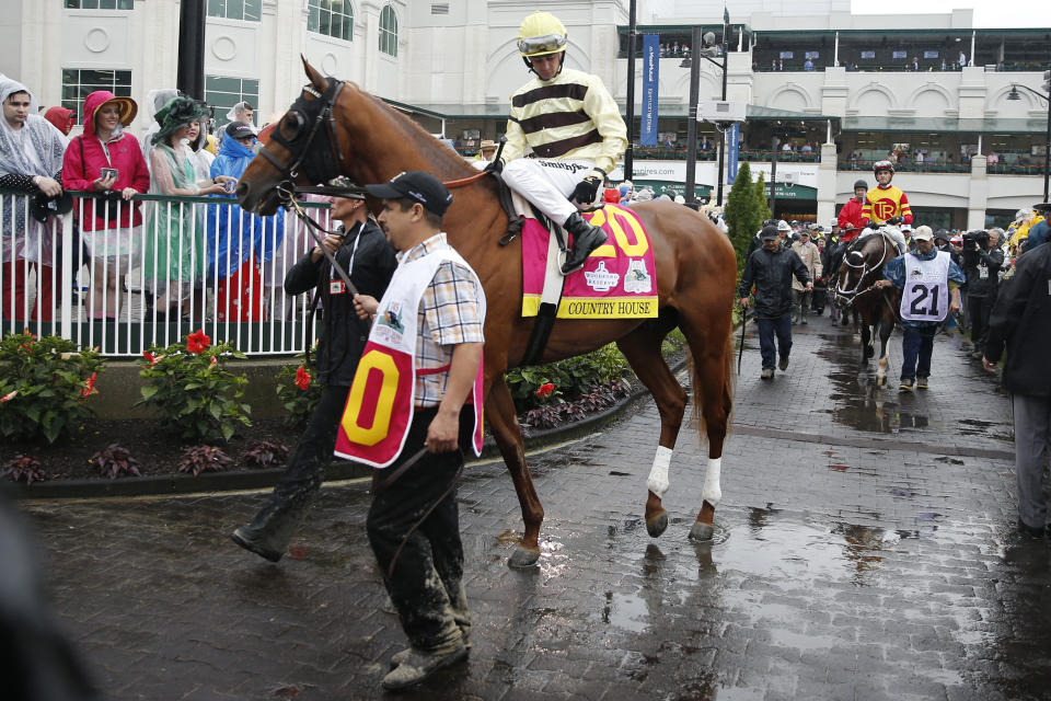 Valets are responsible for saddling horses, preparing jockey silks, and ensuring compliance with weight limits ahead of each race. &ldquo;It entails a whole lot more than people think,&rdquo; Ron Shelton, a veteran valet, told HuffPost this week amid a labor dispute with Churchill Downs over how much the valets are paid. (Photo: Michael Reaves via Getty Images)