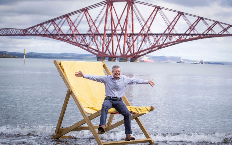 Scottish Liberal Democrat leader Willie Rennie announces his party's plans for teachers while on the Scottish Election campaign trail in South Queensferry - PA