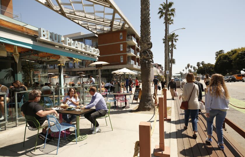 SANTA MONIA, CA - MARCH 29: People dining at Blue Plate Taco in Santa Monica as people take advantage of the warm weather during the COVID-19 Spring break in Southern California Monday. Santa Monica Pier and Promenade on Monday, March 29, 2021 in Santa Monia, CA. (Al Seib / Los Angeles Times).