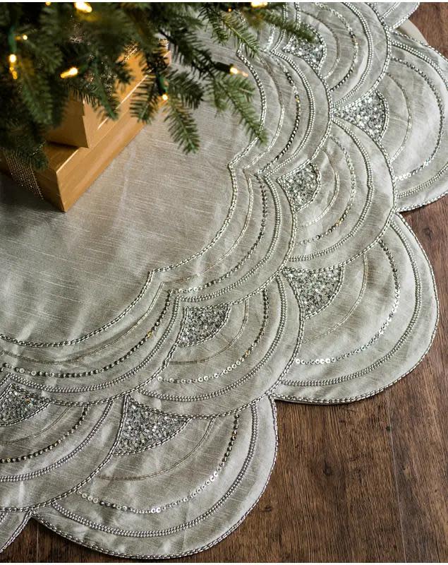 <p><a href="https://go.redirectingat.com?id=74968X1596630&url=https%3A%2F%2Fwww.balsamhill.com%2Fp%2Felizabeth-beaded-scalloped-christmas-tree-skirt&sref=https%3A%2F%2Fwww.thepioneerwoman.com%2Fholidays-celebrations%2Fg37709531%2Fbest-christmas-tree-skirts%2F" rel="nofollow noopener" target="_blank" data-ylk="slk:Shop Now;elm:context_link;itc:0;sec:content-canvas" class="link ">Shop Now</a></p><p>Elizabeth Beaded Tree Skirt</p><p>balsamhill.com</p><p>$139.00</p><span class="copyright">Balsam Hill</span>