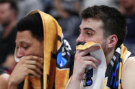 <p>Jeremy Miller #11 and Vasa Pusica #4 of the Northeastern Huskies react on the bench during the second half against the Kansas Jayhawks in the first round of the 2019 NCAA Men’s Basketball Tournament at Vivint Smart Home Arena on March 21, 2019 in Salt Lake City, Utah. (Tom Pennington/Getty Images) </p>