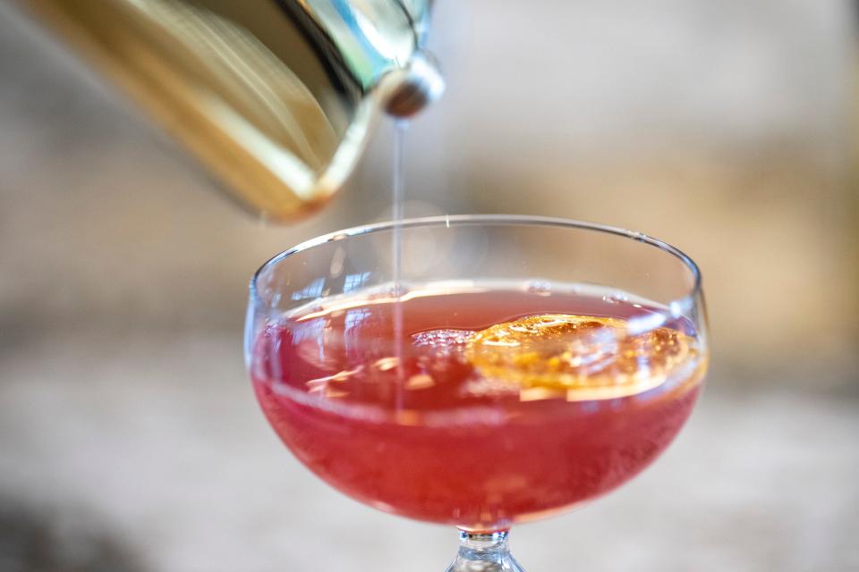 Jan 18, 2023; Columbus, Ohio, USA;  Michael Krebs, operating partner of the new steakhouse Cut 132 in Easton, pours out a Prescription for Peach cocktail, a drink inspired by the Prohibition era. Mandatory Credit: Joseph Scheller-The Columbus Dispatch