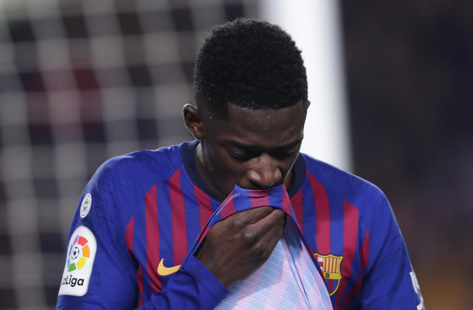 FC Barcelona's Dembele reacts after being injured during the Spanish La Liga soccer match between FC Barcelona and Leganes at the Camp Nou stadium in Barcelona, Spain, Sunday, Jan. 20, 2019. (AP Photo/Manu Fernandez)