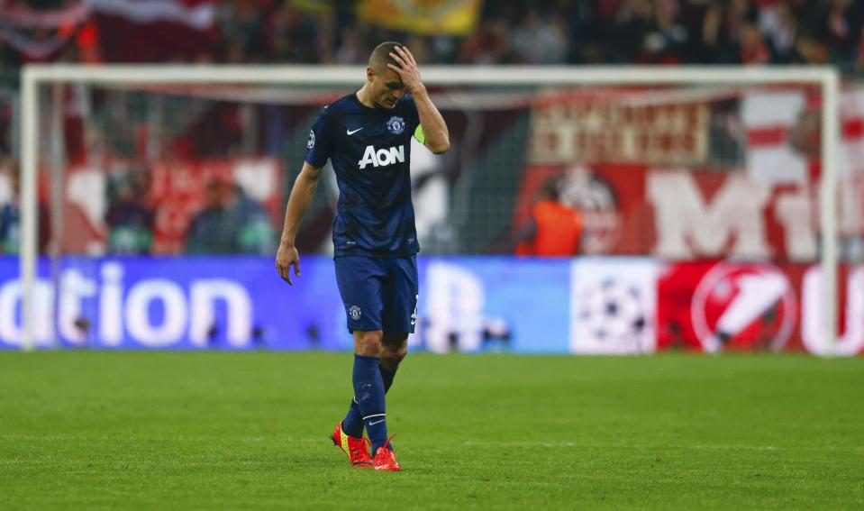 Manchester United's Vidic leaves the pitch after their Champions League quarter-final second leg soccer match against Bayern Munich in Munich