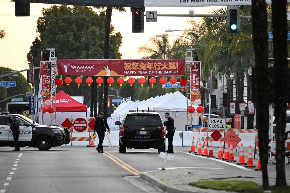 Police stand near the scene of a mass shooting in Monterey Park, California, on January 22, 2023.