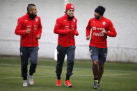 Chile's (L-R) Arturo Vidal, Jorge Valdivia and Jean Beausejour participate in a team training session in Santiago, Chile, July 2, 2015. Chile will face Argentina for their Copa America final on July 4. REUTERS/Ivan Alvarado