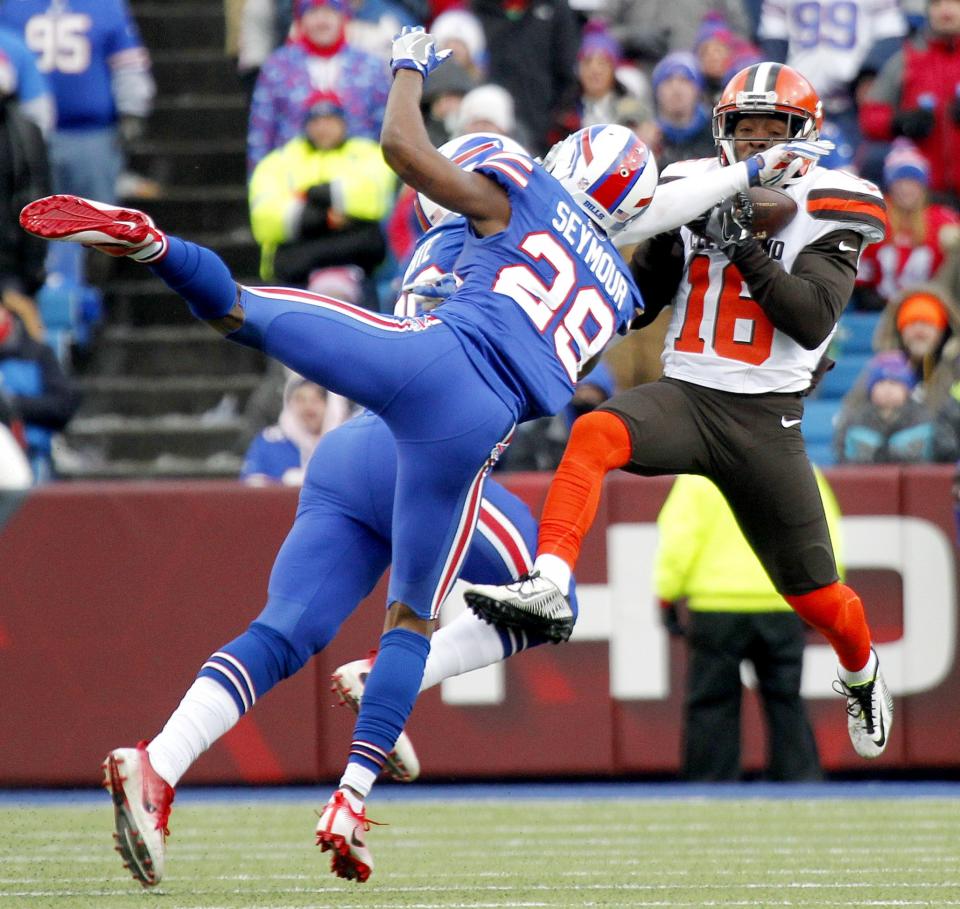 <p>Cleveland Browns wide receiver Andrew Hawkins, right, makes a catch as Buffalo Bills cornerback Ronald Darby (28) and cornerback Corey White (30) defend on the play during the second half of an NFL football game, Sunday, Dec. 18, 2016, in Orchard Park, N.Y. (AP Photo/Jeffrey T. Barnes) </p>