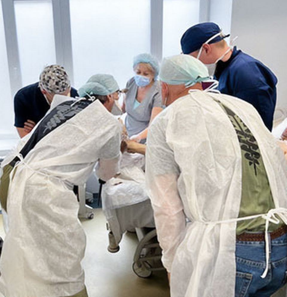 Dr. Enrique Ginzburg, trauma medical director and chief of surgery at Ryder Trauma Center at Jackson Health System, consults with doctors at a hospital in Lviv, Ukraine, which was treating patients who had been injured during the Russian invasion of the Ukraine.