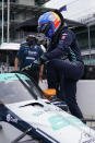 Fernando Alonso, of Spain, climbs into his car during a practice session for the Indianapolis 500 auto race at Indianapolis Motor Speedway, Wednesday, Aug. 12, 2020, in Indianapolis. (AP Photo/Darron Cummings)