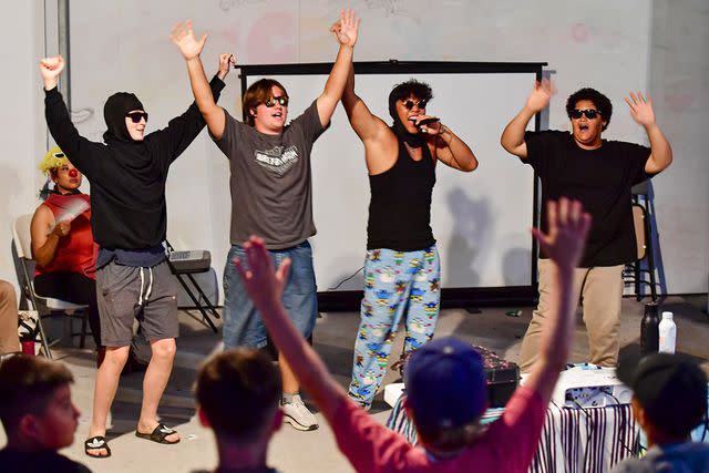 <p>Courtesy Experience Camps</p> Campers show off their talent in a boy-band lip-synch at our camp in California, August 2023