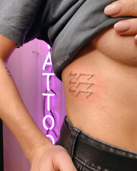 cursive tattoo ribs