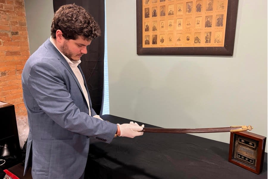 Adam Fleischer, President of Fleischer’s Auctions, holds Civil War Union Gen. William Tecumseh Sherman’s sword and scabbard, Thursday, May 9, 2024, in Columbus, Ohio. The wartime sword, likely used between 1861 and 1863, are among the items that will be open to bidders Tuesday, May 14, 2024, at Fleischer’s Auctions. (AP Photo/Patrick Orsagos)