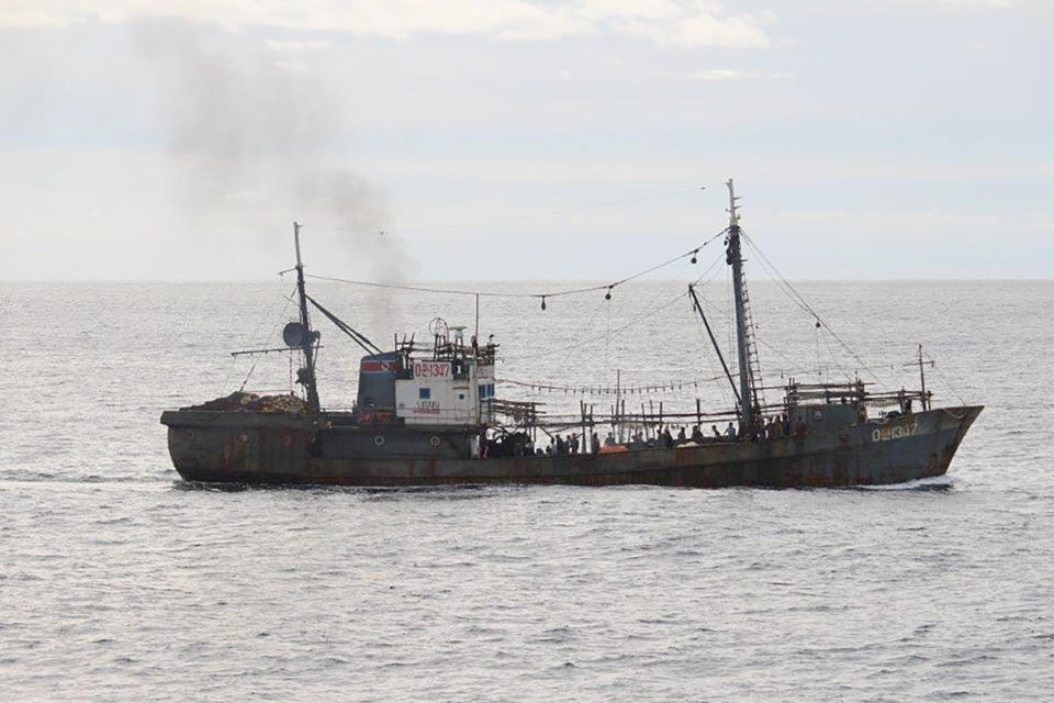 This Monday, Oct. 7, 2019, photo released by Japan's Fisheries Agency, shows a fishing boat which collided with a Japanese patrol vessel off the northwestern coast of the Noto Peninsula, Ishikawa prefecture, Japan. Japanese authorities said they rescued all of about 60 North Korean fishermen whose boat sank after the collision in an area crowded with poachers. (Fisheries Agency via AP)