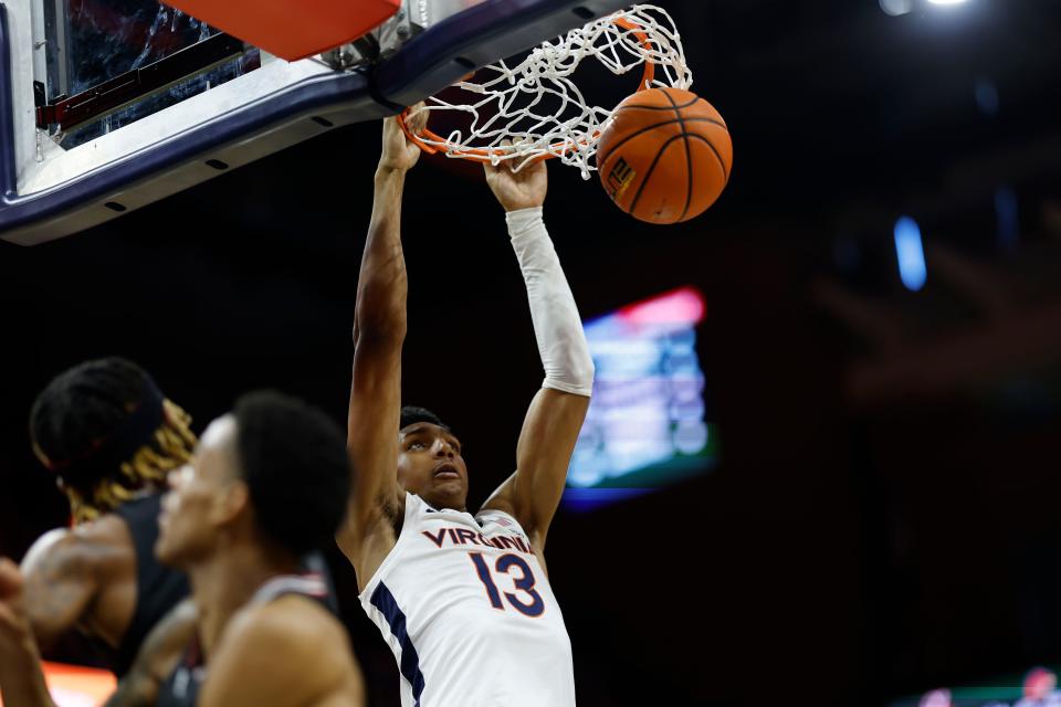 Mar 4, 2023; Charlottesville, Virginia, USA; Virginia Cavaliers guard Ryan Dunn (13) dunks the ball against the Louisville Cardinals in the second half at John Paul Jones Arena. Mandatory Credit: Geoff Burke-USA TODAY Sports