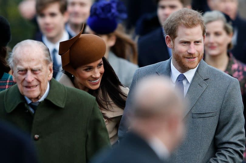 Britain's Prince Philip, Duke of Edinburgh, US actress and fiancee of Britain's Prince Harry Meghan Markle and Britain's Prince Harry (R) arrive to attend the Royal Family's traditional Christmas Day church service at St Mary Magdalene Church in Sandringham, Norfolk, eastern England.
