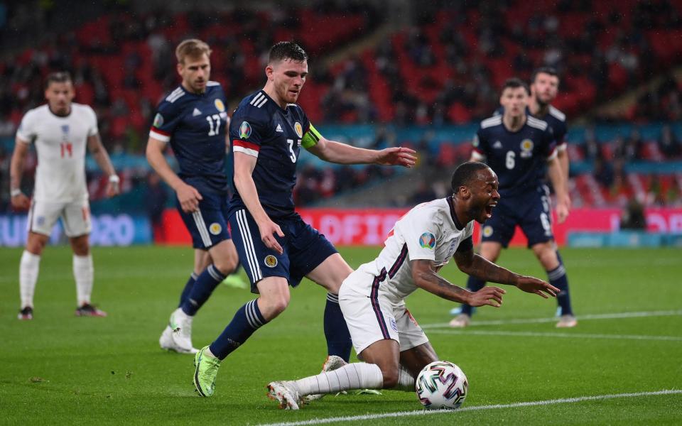 Raheem Sterling of England is challenged by Andrew Robertson - Getty Images