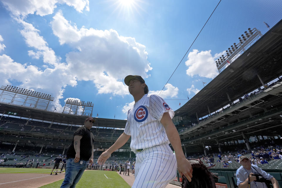 Chicago Cubs pitcher Shota Imanaga heads to the bullpen to warm up before a baseball game against the Pittsburgh Pirates, Saturday, May 18, 2024, in Chicago. (AP Photo/Charles Rex Arbogast)