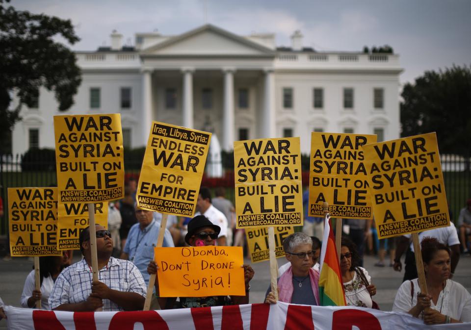 The "Act now to stop war and end racism" (ANSWER) coalition holds a rally outside the White House in Washington, August 29, 2013. The group rallied their opposition to U.S.-led military action on Syria. REUTERS/Jason Reed (UNITED STATES - Tags: POLITICS CIVIL UNREST TPX IMAGES OF THE DAY)