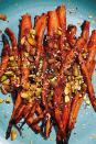 <p>These sweet-savory carrots are topped with the most delicious mix of crunchy nuts and spices. We like pistachios and black and white sesame seeds, but feel free to swap in your favorites.</p><p>Get the <strong><a href="https://www.delish.com/cooking/recipe-ideas/a36973856/miso-roasted-carrots-recipe/" rel="nofollow noopener" target="_blank" data-ylk="slk:Miso Roasted Carrots recipe;elm:context_link;itc:0;sec:content-canvas" class="link ">Miso Roasted Carrots recipe</a></strong>.</p>