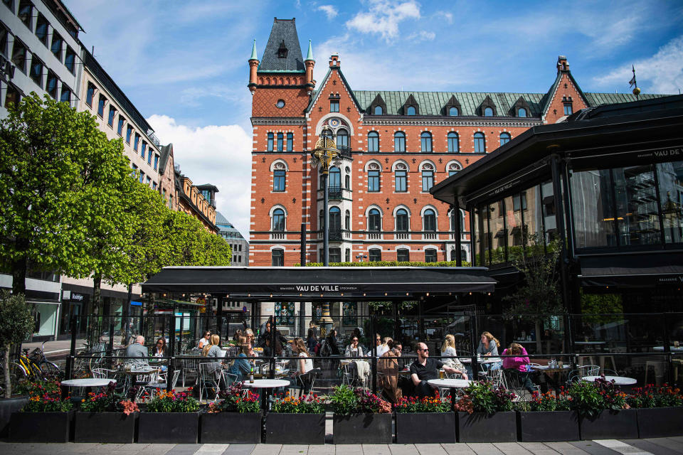 Image: People sit in a restaurant in Stockholm on May 8, 2020, amid the coronavirus COVID-19 pandemic. (Jonathan Nackstrand / AFP - Getty Images)