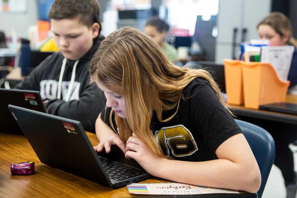 Sixth Grader Kaydence Mason works on a writing assignment, on Wednesday, Feb. 16, 2022, at Cardinal Middle School, in Eldon. 