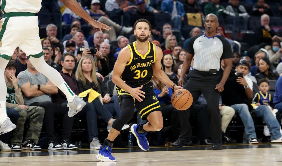 Stephen Curry returned to form with six 3-pointers on Tuesday, including a dagger in the final seconds to beat the Boston Celtics. (Ezra Shaw/Getty Images)