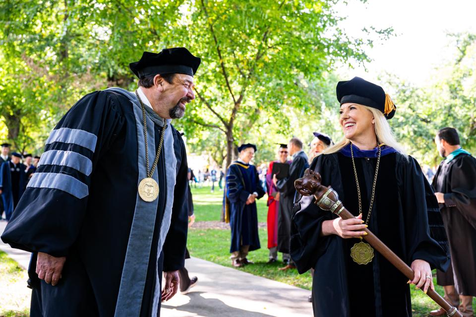 Colorado State University President Amy Parsons shares a moment with former president Tony Frank after her Fall Address speech on Wednesday.