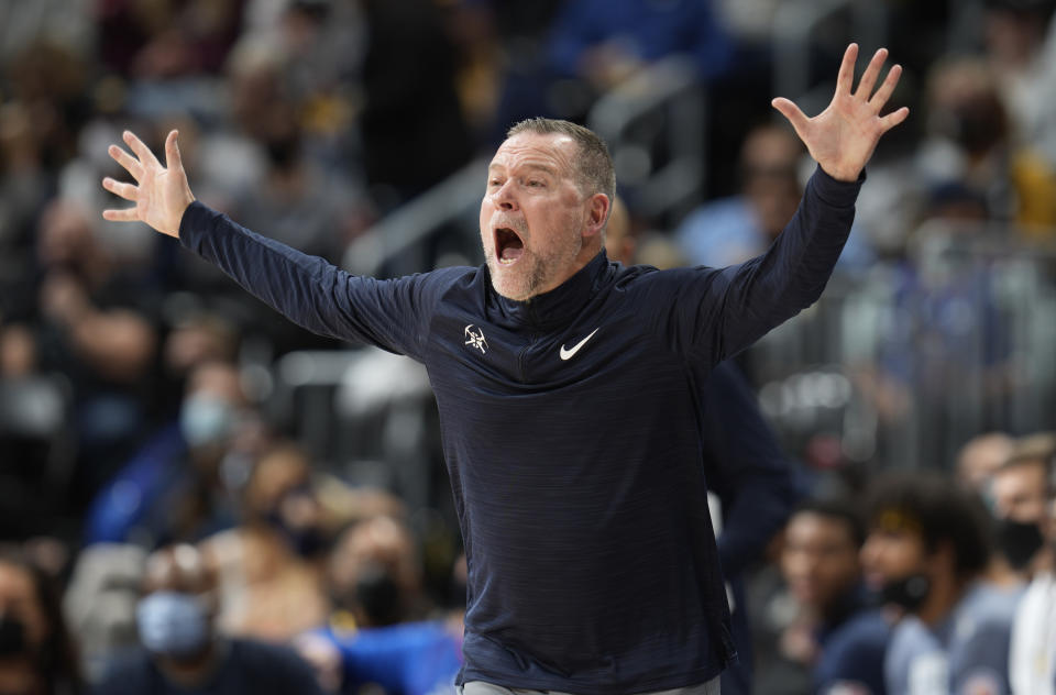 Denver Nuggets coach Michael Malone gestures during the second half of the team's NBA basketball game against the Atlanta Hawks on Friday, Nov. 12, 2021, in Denver. (AP Photo/David Zalubowski)