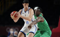Nigeria's Olumiye Oni (13), right, tries to steal the ball by Italy's Simone Fontecchio (13), left, during men's basketball preliminary round game at the 2020 Summer Olympics, Saturday, July 31, 2021, in Saitama, Japan. (AP Photo/Charlie Neibergall)