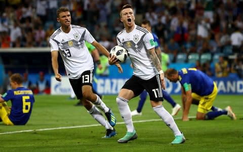 Marco Reus of Germany celebrates with Thomas Mueller after scoring his sides opening goal - Credit: GETTY IMAGES