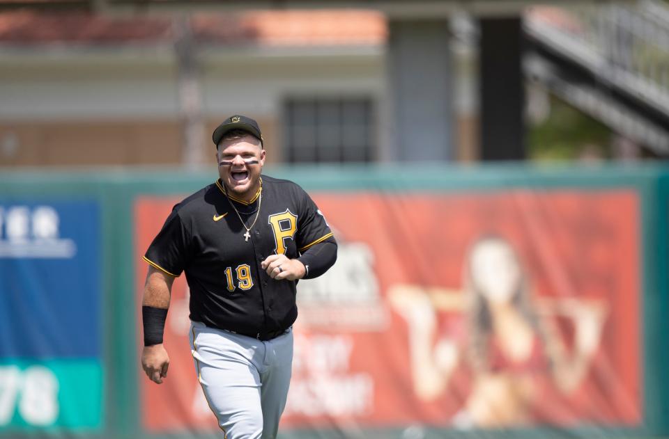 Daniel Vogelbach of the Pittsburgh Pirates signs reacts after greeting Twins players before playing in a spring training game against the Minnesota Twins at Hammond Stadium on Wednesday, March 30, 2022. He is a Bishop Verot graduate and this is the first time as a pro that he is playing spring training in Fort Myers 