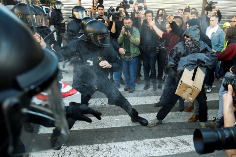 Catalan regional police 'Mossos D'Esquadra' officers clash with separatist protesters during a demonstration in support of Spanish police called by the 'Jusapol' police association in Barcelona last month