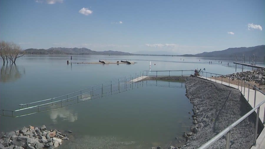 A walkway is fully submerged in Lake Elsinore due to a series of record-breaking rainstorms. (KTLA)
