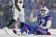 Buffalo Bills quarterback Josh Allen (17) reacts after taking a hit from the Cincinnati Bengals during the fourth quarter of an NFL division round football game, Sunday, Jan. 22, 2023, in Orchard Park, N.Y. (AP Photo/Joshua Bessex)