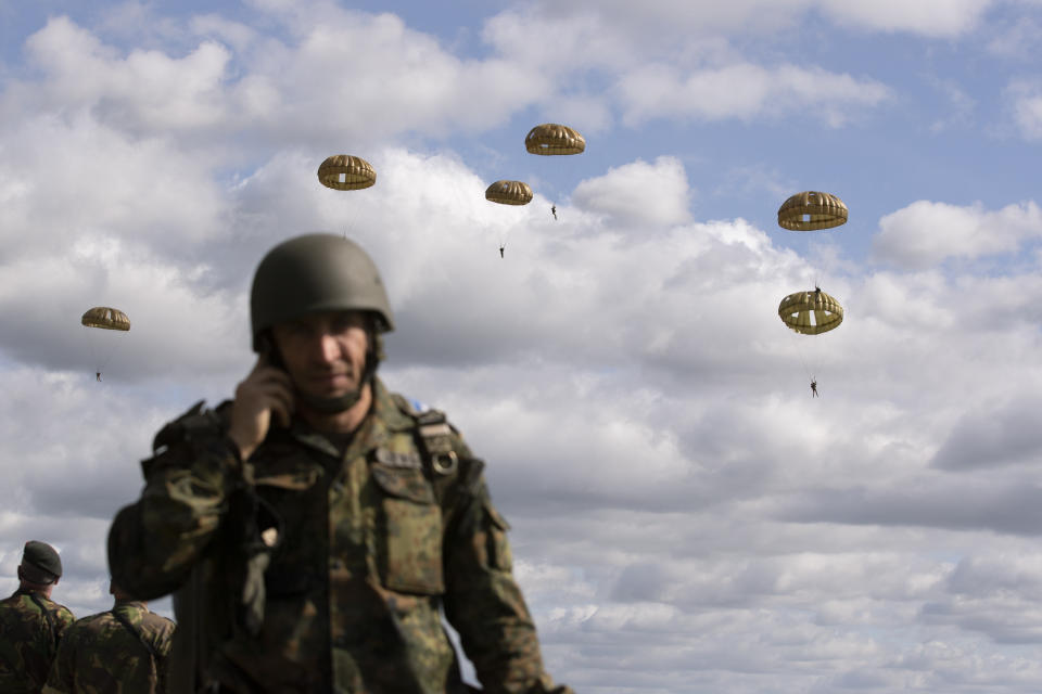 Parachutist jump from a plane near Groesbeek, Netherlands, Thursday, Sept. 19, 2019, as part of commemorations marking the 75th anniversary of Operation Market Garden, an ultimately unsuccessful airborne and land offensive that Allied leaders hoped would bring a swift end to World War II by capturing key Dutch bridges and opening a path to Berlin. (AP Photo/Peter Dejong)