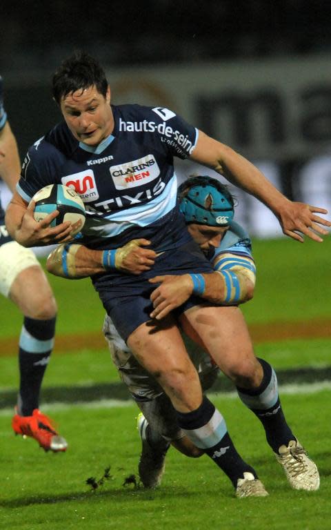 Racing Metro 92's French center Henry Chavancy (L) is tackled by Bayonne's French flanker Jean Monribot during the Top 14 rugby union match between Bayonne and Racing Metro 92 on March 27, 2015 in Bayonne, France