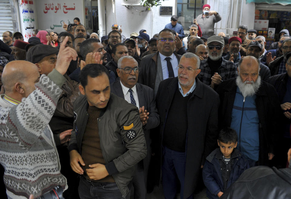 Supporters of the Tunisian Islamist movement Ennahda stage a protest in front of the justice ministry to denounce the arrest one of its senior leader in Tunis, Tunisia, Friday, Dec. 23, 2022. The protesters denounced the arrest of one of its senior leaders, suspected of being involved in sending Tunisians to fight with extremists in Syria. (AP Photo/Hassene Dridi)