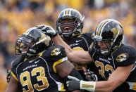 COLUMBIA, MO - NOVEMBER 12: Terrell Resonno #93 of the Missouri Tigers is congratulated by teammates after sacking quarterback David Ash #14 of the Texas Longhorns during the game on November 12, 2011 at Faurot Field/Memorial Stadium in Columbia, Missouri. (Photo by Jamie Squire/Getty Images)