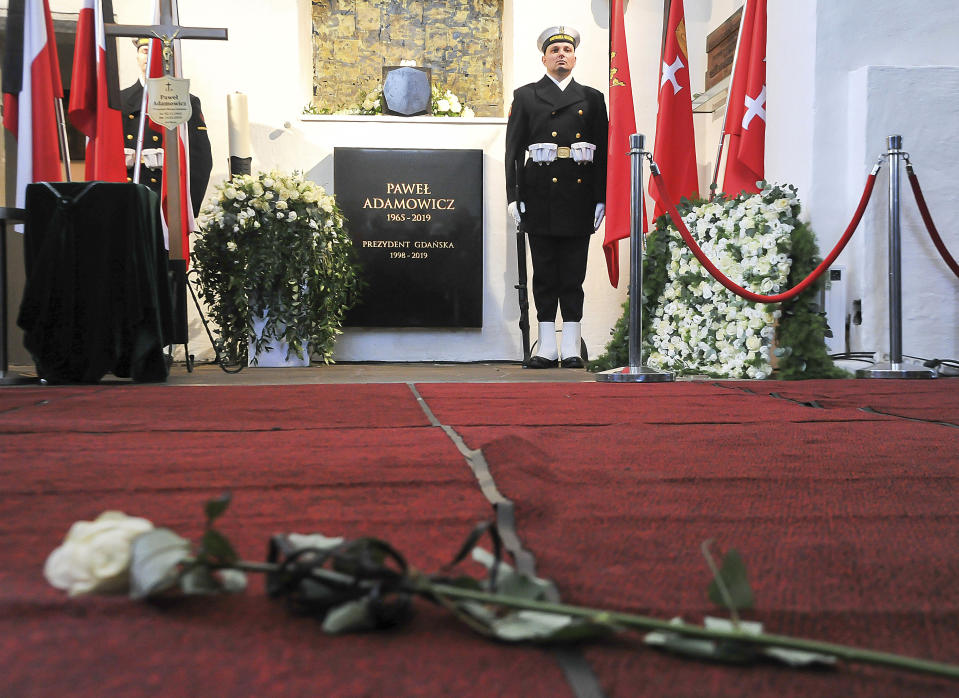 A black urn containing the ashes of slain Gdansk city Mayor Pawel Adamowicz placed in a niche at the city's basilica following his funeral attended by Poland's and European dignitaries, at St. Mary's Basislica in Gdansk, Poland, on Saturday, Jan. 19, 2019. Adamowicz died Monday after being stabbed the night before at a charity event by an ex-convict with a grudge against an opposition party that Adamowicz once belonged to.(AP Photo/Wojtek Strozyk)