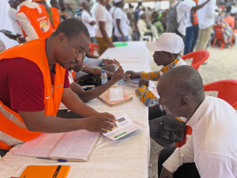 Ivory Coast gives cocoa farmers electronic cards to track beans, ensure fair price in Agboville