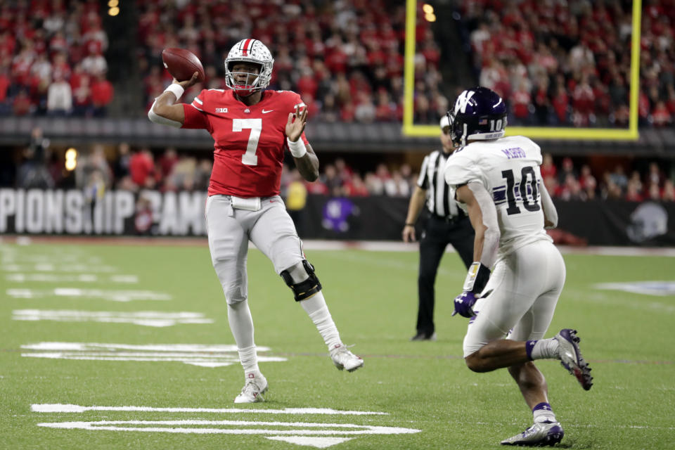 Ohio State quarterback Dwayne Haskins (7) throws as Northwestern defensive back Alonzo Mayo (10) defends during the second half of the Big Ten championship NCAA college football game, Saturday, Dec. 1, 2018, in Indianapolis. (AP Photo/Michael Conroy)